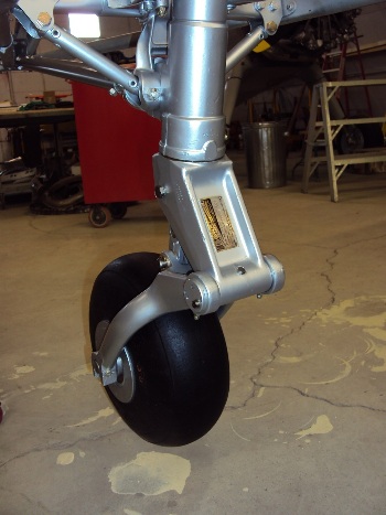 Tail wheel and strut fully restored and installed.