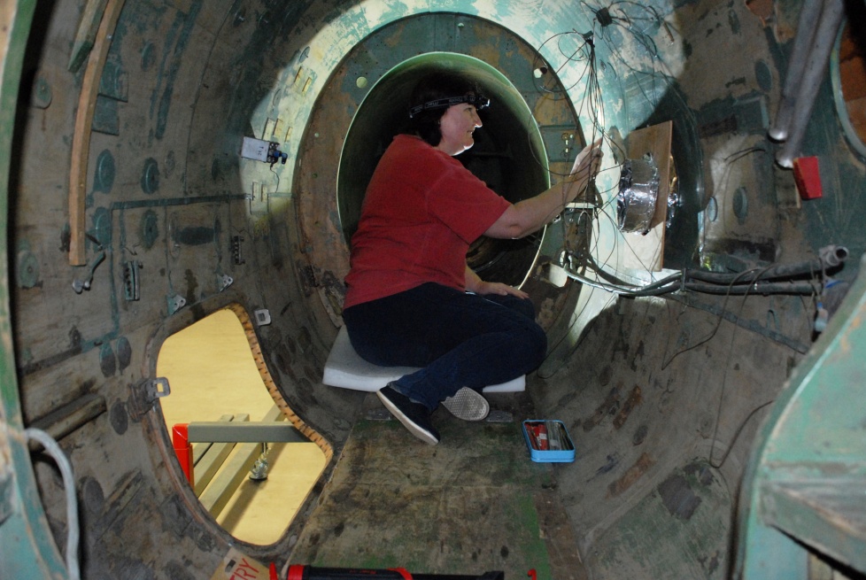 CMS Treasurer Colette P. has invested many hours in the 'glamorous' work of cleaning and scraping the interior of the rear fuselage.